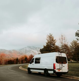 Van driving down a mountain road