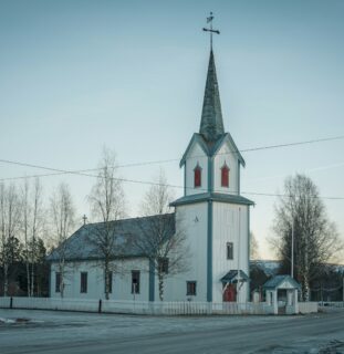 White wooden church in the snow