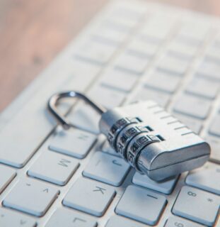 Padlock resting on a computer keyboard